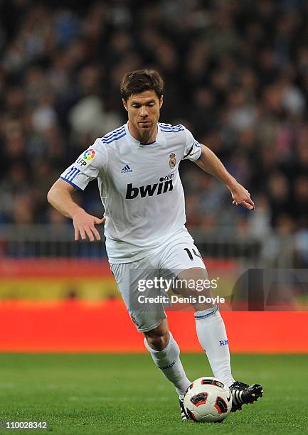 Xabi Alonso of Real Madrid in action during the La Liga match between Real Madrid and Hercules CF at Estadio Santiago Bernabeu on March 12, 2011 in...