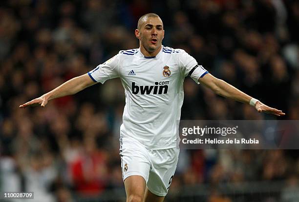 Karim Benzema of Real Madrid celebrates after scoring his side opening goal during the La Liga match between Real Madrid and Hercules at Estadio...