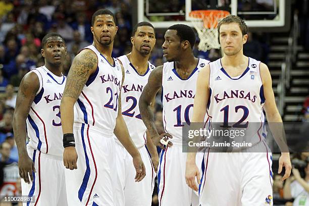 Josh Selby, Markieff Morris, Marcus Morris,Tyshawn Taylor and Brady Morningstar of the Kansas Jayhawks stand on the court against the Texas Longhorns...