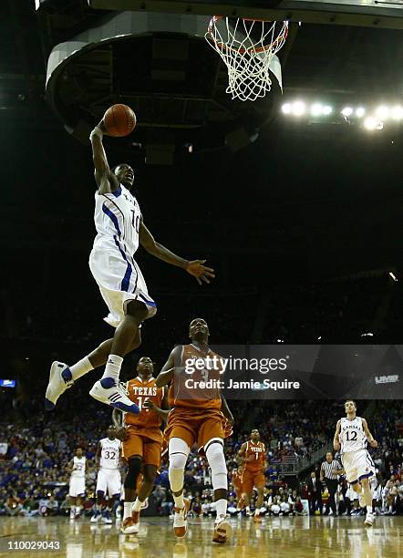 Tyshawn Taylor of the Kansas Jayhawks goes up to dunk the ball against the Texas Longhorns in the first half of the 2011 Phillips 66 Big 12 Men's...