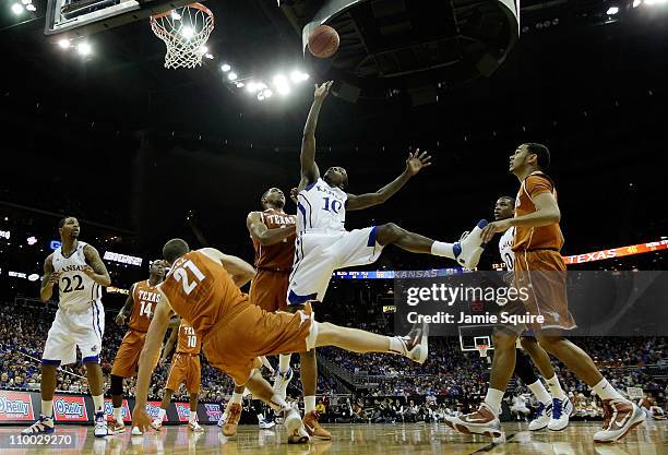 Tyshawn Taylor of the Kansas Jayhawks throws up a shot against the Texas Longhorns during the 2011 Phillips 66 Big 12 Men's Basketball Tournament...