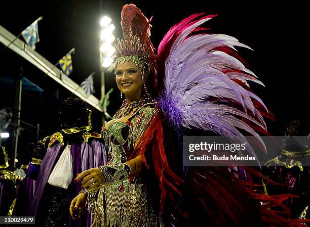 Luiza Brunet, queen of the drummers of Imperatriz, dances during the samba school's champions parade at Marques de Sapucai on March 12, 2011 in Rio...