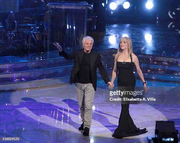Italian actor Michele Placido and presenter Milly Carlucci attend the Italian TV show 'Ballando Con Le Stelle' at RAI Auditorium on March 12, 2011 in...