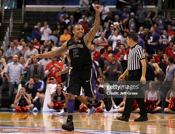 Isaiah Thomas of the Washington Huskies reacts as the Arizona Wildcats miss a buzzer shot and the game goes into overtime in the championship game of...