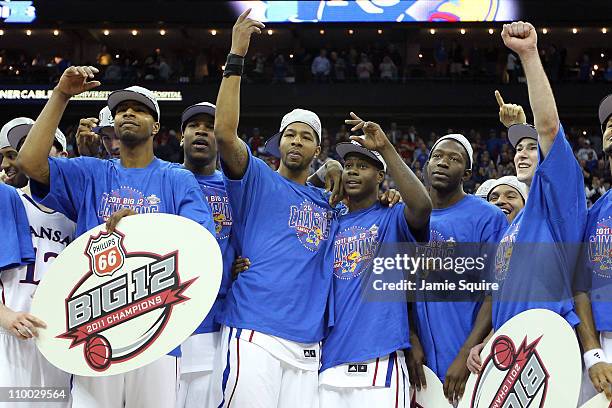 Markieff Morris and Josh Selby of the Kansas Jayhawks of the Kansas Jayhawks celebrate with their teammates after defeating the Texas Longhorns 85-73...