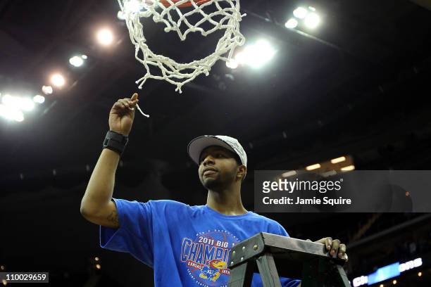 Markieff Morris of the Kansas Jayhawks celebrates by cutting down the net after defeating the Texas Longhorns 85-73 to win the 2011 Phillips 66 Big...
