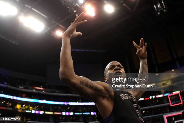Isaiah Thomas of the Washington Huskies reacts after making a last-second shot in overtime to defeat the Arizona Wildcats 77-75 in the championship...