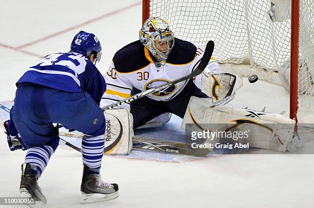Tyler Bozak of the Toronto Maple Leafs scores a second period goal on Ryan Miller of the Buffalo Sabres March 12, 2011 at the Air Canada Centre in...
