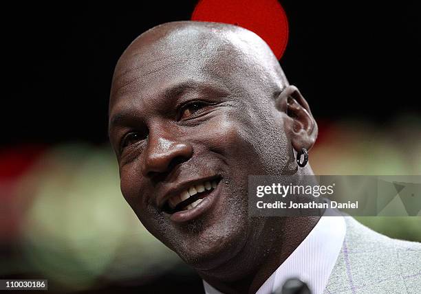 Former player Michael Jordan of the Chicago Bulls addresses the crowd during a 20th anniversary recognition ceremony of the Bulls 1st NBA...