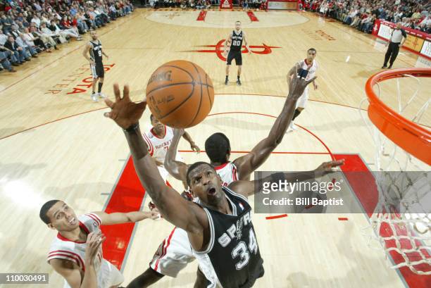 Antonio McDyess of the San Antonio Spurs shoots the ball over Kevin Martin of the Houston Rockets on March 12, 2011 at the Toyota Center in Houston,...