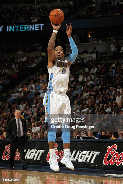 Smith of the Denver Nuggets takes a three point shot as he had a game high 31 points against the Detroit Pistons as he goes to the basket at the...