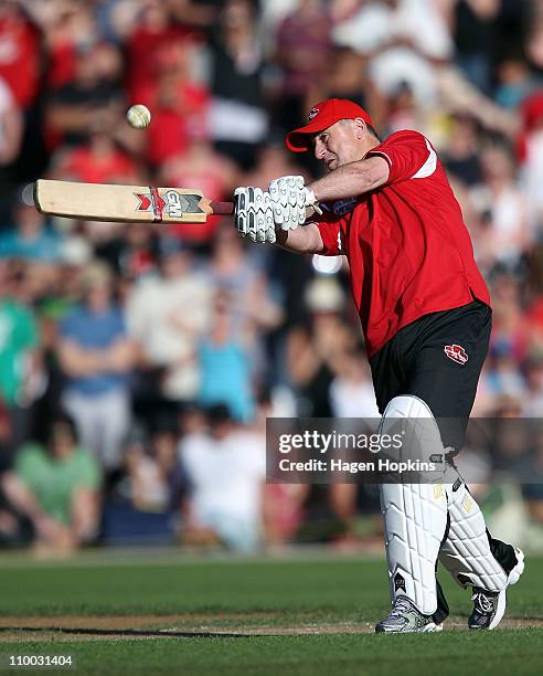 New Zealand Prime Minister John Key bats off the bowling of Shane Warne in their one on one challenge during the Christchurch Earthquake Relief...