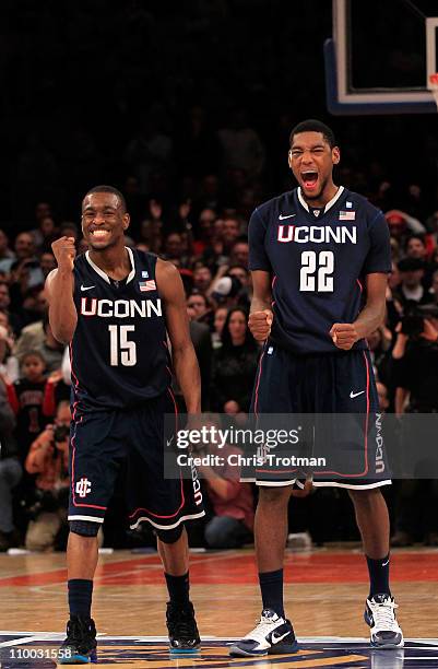 Kemba Walker and Roscoe Smith of the Connecticut Huskies celebrate late in the game against the Louisville Cardinals during the championship of the...