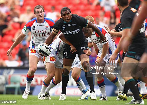 Petero Civoniceva of the Panthers is tackled during the round one NRL match between the Penrith Panthers and the Newcastle Knights at Centrebet...