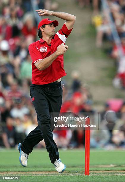 Stephen Fleming bowls during the Christchurch Earthquake Relief Charity Twenty20 match at Basin Reserve on March 13, 2011 in Wellington, New Zealand.