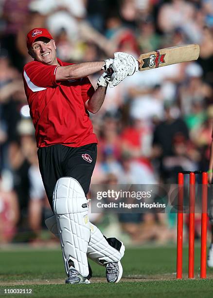 New Zealand Prime Minister John Key bats off the bowling of Shane Warne after their one on one challenge during the Christchurch Earthquake Relief...