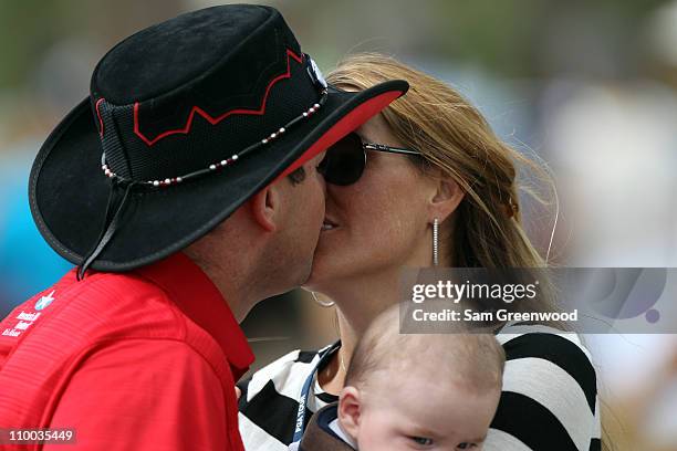 Rory Sabbatini of South Africa hugs his wife Amy and son Bodhi after winning The Honda Classic at PGA National Resort and Spa on March 6, 2011 in...