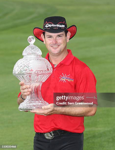 Rory Sabbatini of South Africa poses with the trophy after winning The Honda Classic at PGA National Resort and Spa on March 6, 2011 in Palm Beach...