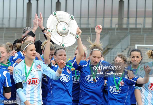 Desiree Schumann, Isabel Kerschowski, Babett Peter, Marie - Louise Bagehorn and Fatmire Bajramaj celebrate with the trophy after winning the Women...