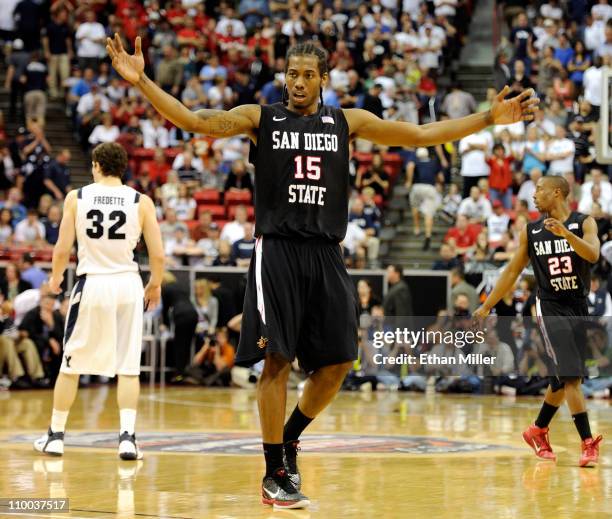 Kawhi Leonard of the San Diego State Aztecs raises his arms in the last few seconds of the team's 72-54 victory over the Brigham Young University...