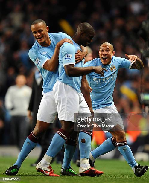 Nigel De Jong of Manchester City celebrates with goalscorer Micah Richards and teammate Vincent Kompany during the FA Cup sponsored by E.On Sixth...