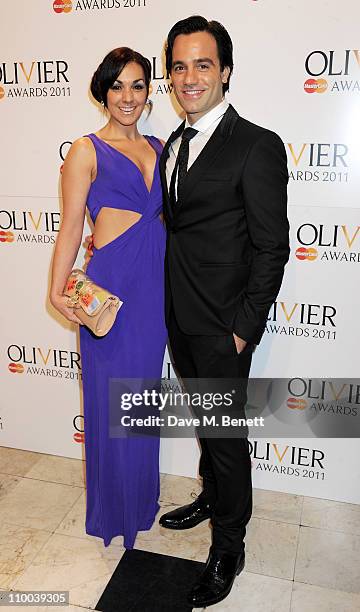 Actor Ramin Karimloo and Mandy Karimloo arrive at the Olivier Awards 2011 at Theatre Royal Drury Lane on March 13, 2011 in London, England.