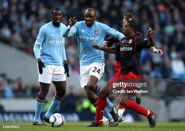 Patrick Vieira of Manchester City is tackled by Mikele Leigertwood of Reading during the FA Cup sponsored by E.On Sixth Round match between...