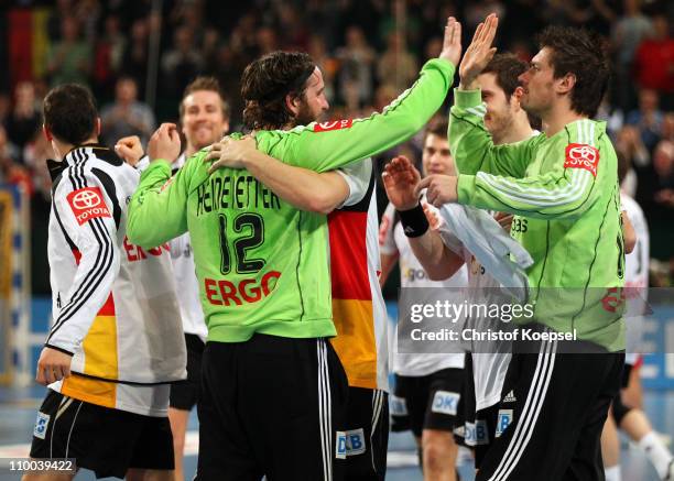 Silvio Heinevetter and Carsten Lichtlein of Germany celebrate after the Handball Euro Qualifier match between Germany and Iceland at Gerry Weber...