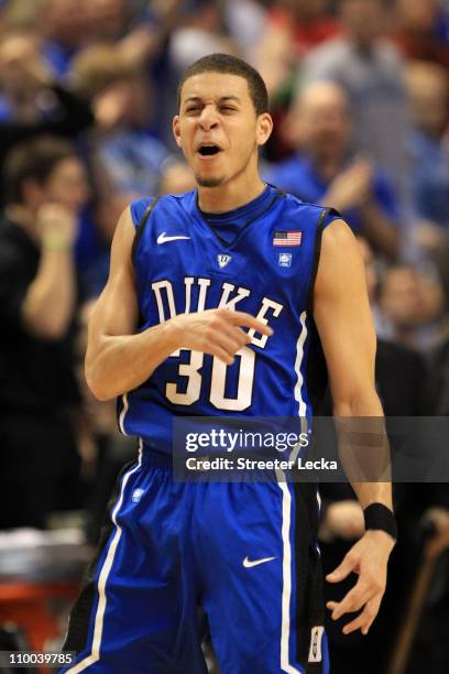 Seth Curry of the Duke Blue Devils celebrates their 75-58 victory over the North Carolina Tar Heels in the championship game of the 2011 ACC men's...