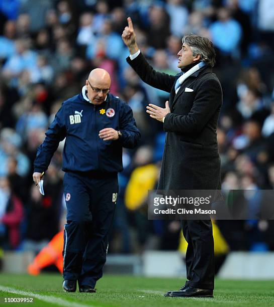 Manchester City manager Roberto Mancini directs his team during the FA Cup sponsored by E.On Sixth Round match between Manchester City and Reading at...