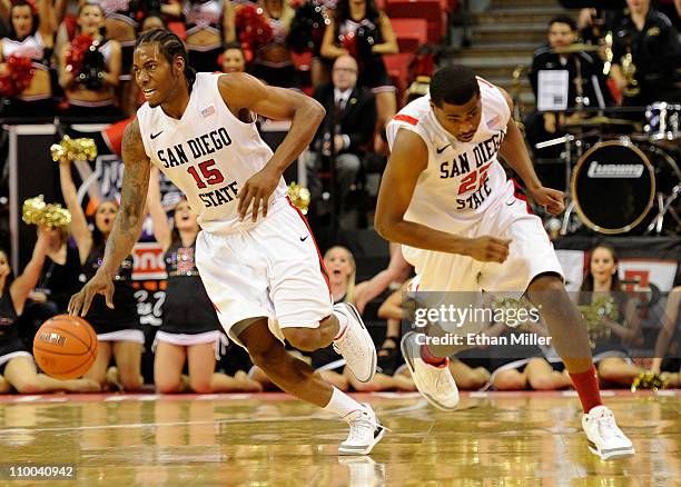 Kawhi Leonard and Chase Tapley of the San Diego State Aztecs start a fast break during a quarterfinal game of the Conoco Mountain West Conference...