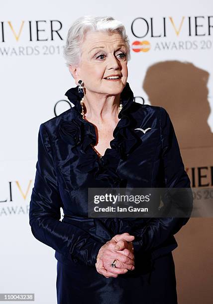 Actress Angela Lansbury poses in the press room during The Olivier Awards 2011 at Theatre Royal on March 13, 2011 in London, England.