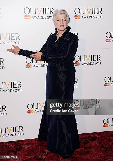 Actress Angela Lansbury poses in the press room during The Olivier Awards 2011 at Theatre Royal on March 13, 2011 in London, England.