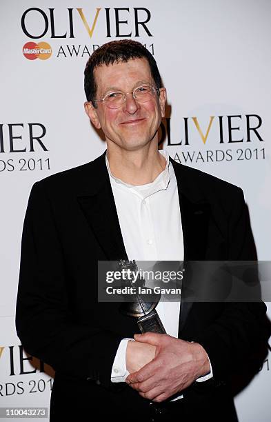 Antony Gormley, winner of Outstanding Achievement in Dance for the set design in "Babel" poses in the press room during The Olivier Awards 2011 at...