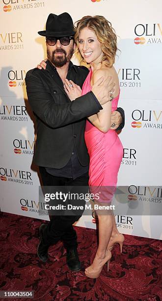 Dave Stewart and Caissie Levy pose in the winner's room during the Olivier Awards 2011 at Theatre Royal Drury Lane on March 13, 2011 in London,...