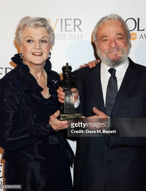Angela Lansbury and Society of London Special Award winner Stephen Sondheim pose in the winner's room during the Olivier Awards 2011 at Theatre Royal...
