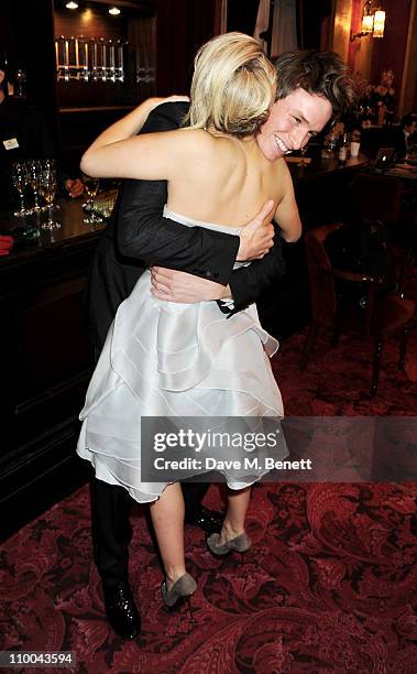 Actor Eddie Redmayne and Best Actress in a Musical winner Sheridan Smith celebrate in the winner's room during the Olivier Awards 2011 at Theatre...