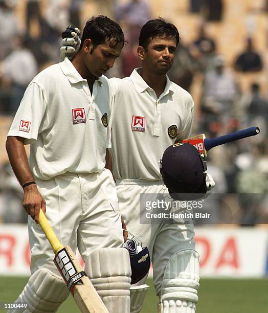 Laxman and Rahul Dravid of India leave the field at lunch, during day four of the 2nd Test between India and Australia played at Eden Gardens,...