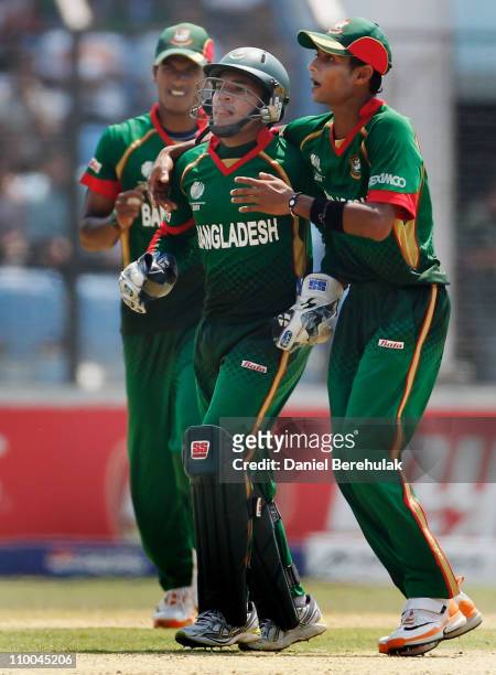 Wicketkeeper Mushfiqur Rahim of Bangladesh celebrates with team mates after stumping Alexei Kervezee of the Netherlands during the 2011 ICC Cricket...