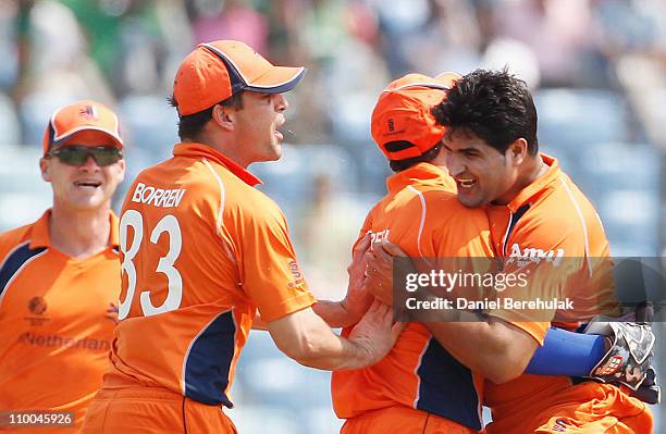 Mudassar Bukhari of the Netherlands celebrateswith teammates after taking the wicket of Tamim Iqbal of Bangladesh during the 2011 ICC Cricket World...