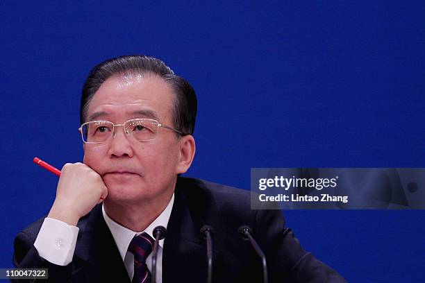 China's Premier Wen Jiabao gestures as he answers a question during his annual press conference after the closing of the session of the National...