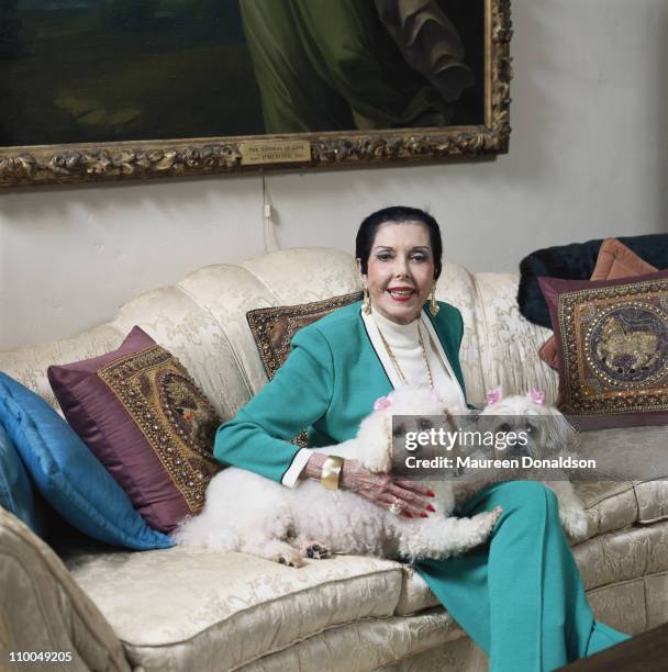 American actress, singer and dancer Ann Miller at home with her pet toy poodles, circa 1995.