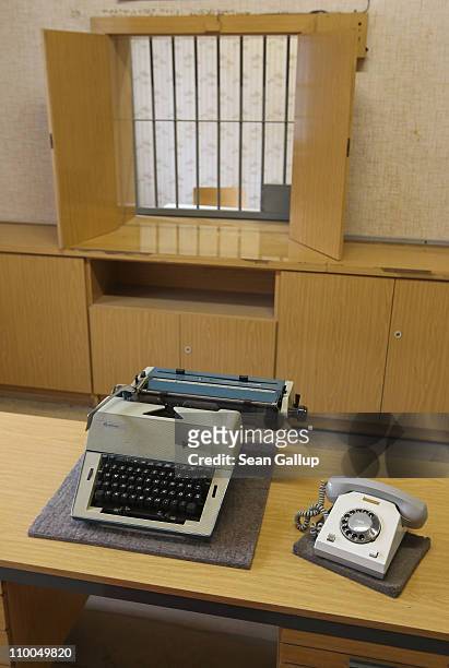 Typewriter and phone lie on a table in a room used for issuing arrest warrants at the former prison of the East German Ministry of State Security,...