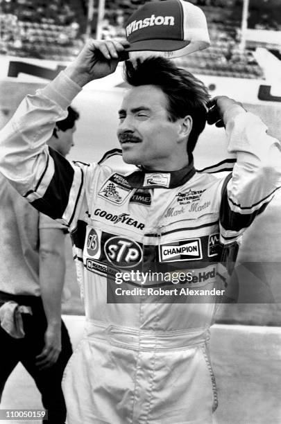 Mark Martin prepares to climb into his car during qualifying for the 1985 Daytona 500 in February, 1985 at the Daytona International Speedway in...