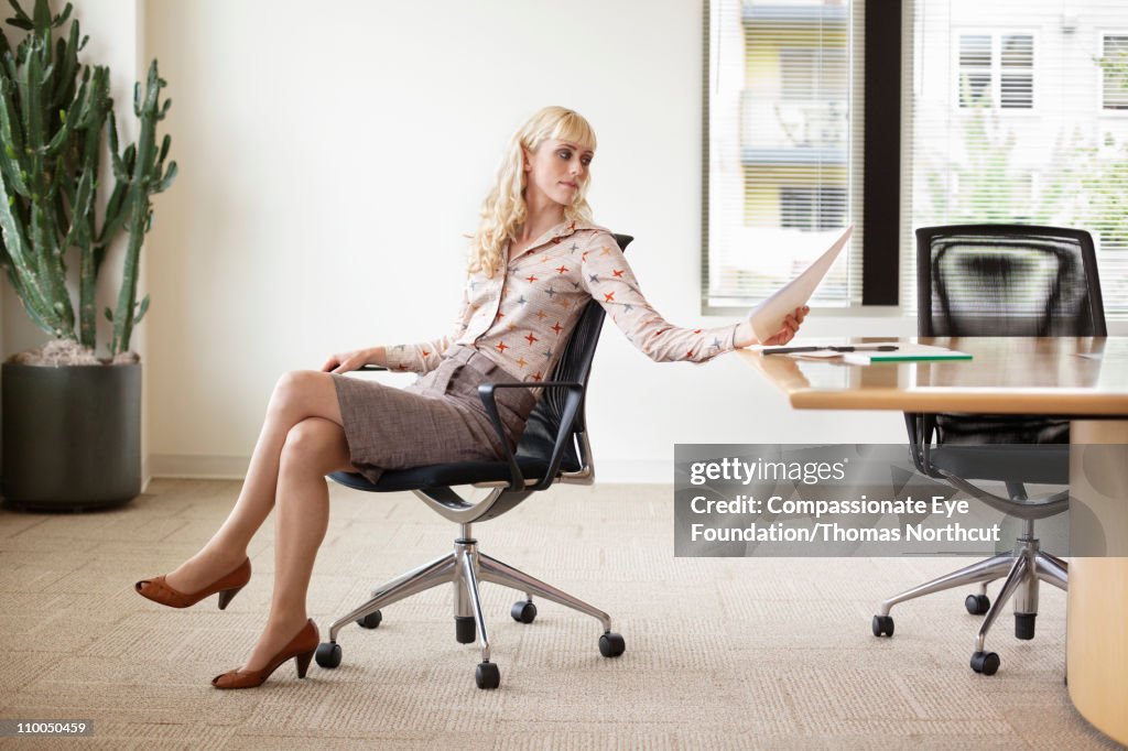 Professional woman sittin at office table