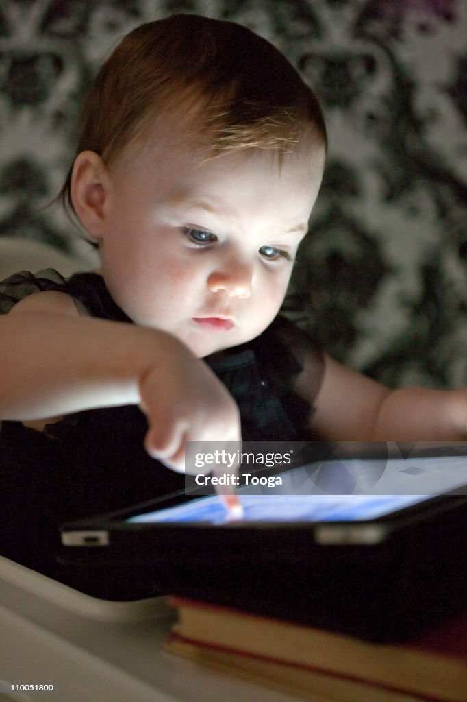 Baby using digital tablet