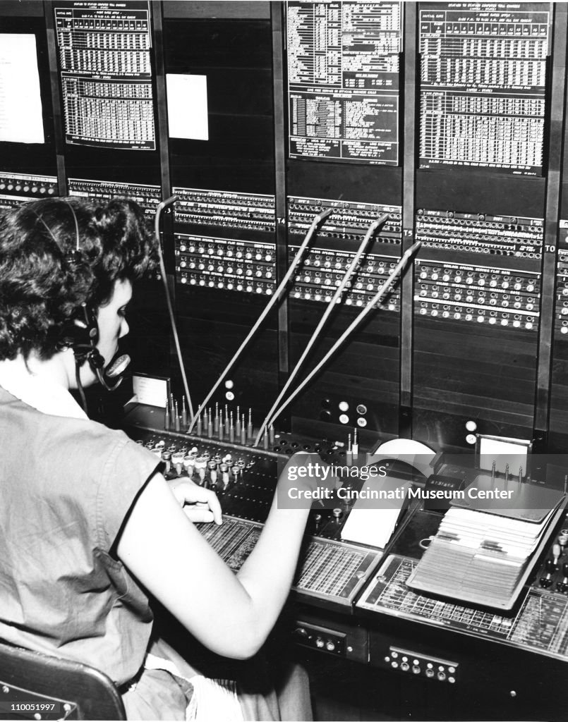 View of an unidentified Cincinnati Bell operator as she works at a ...