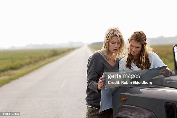 road trip - woman map stock pictures, royalty-free photos & images