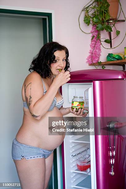 pregnant woman eating pickles - vintage tattoo stock-fotos und bilder