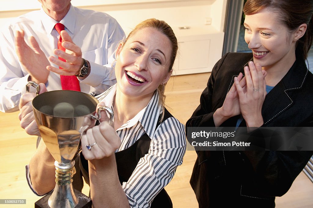 Happy colleague receives prize